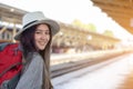 Portrait charming beautiful traveler woman. Young woman traveler waiting for train at train station, Travel and active lifestyle