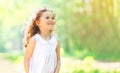 Portrait of charming curly little girl enjoying summer Royalty Free Stock Photo