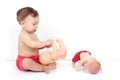 Portrait of a charming cute child enthusiastically playing with dolls