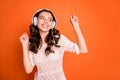 Portrait of charming cute girl listen music on her modern headset like playlist dance wear good looking outfit isolated Royalty Free Stock Photo