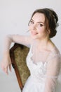 Portrait of a charming dark-haired bride, Studio, close-up. Wedding hairstyle and makeup. Young woman in luxurious Royalty Free Stock Photo