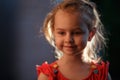 Portrait of a charming fair-haired girl standing outside on a warm summer evening, the sun illuminates the hair from Royalty Free Stock Photo