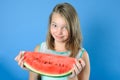 Portrait of charming girl with a big piece of ripe juicy watermelon.