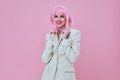 Portrait of a charming lady in White blazer pink hair Glamor Cosmetics color background unaltered Royalty Free Stock Photo