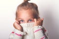 Portrait of a charming little girl in beige sweate. Royalty Free Stock Photo