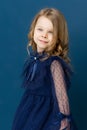 Portrait charming little girl in nice blue dress Royalty Free Stock Photo