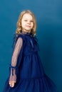 Portrait charming little girl in nice blue dress Royalty Free Stock Photo