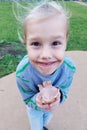 Portrait of a charming little girl 7 years old. A big smile on his face. His face is smeared with ice cream. Royalty Free Stock Photo