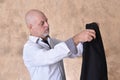 portrait of charming man in black suit white gray beard smiling