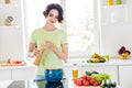 Portrait of charming peaceful lady put spaghetti boiling water enjoy free time morning indoors