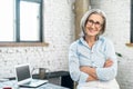 Positive businesswoman standing with arms folded Royalty Free Stock Photo