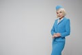 Portrait of charming stewardess wearing in blue uniform. Royalty Free Stock Photo