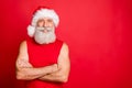 Portrait of charming trendy santa claus real coach with his hands crossed looking with toothy smile wearing nicholas cap