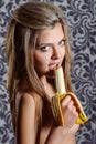 Portrait of charming woman eating banana Royalty Free Stock Photo