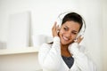 Charming woman with headphone listening music