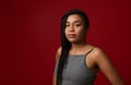 Portrait of a charming young African American beautiful woman with stylish traditional dreadlocks, confidently looking at camera,