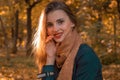 Portrait of a charming young girl with red lipstick in warm scarf close-up Royalty Free Stock Photo