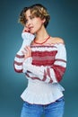 Portrait of charming young lady with short hair in embroide
