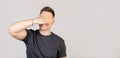 Portrait of a young man, guy covering his eyes with his palm and smiling, waiting for an unexpected gift Royalty Free Stock Photo