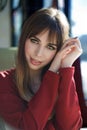 Portrait charming young woman with friendly smile, long brunette hair smiling cafe Royalty Free Stock Photo