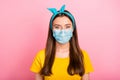 Portrait of charming youngster lady stay home covid-19 quarantine wearing breathing mask yellow t-shirt isolated over