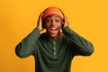 Portrait Of Cheerful African American Guy In Wireless Headphones Looking At Camera Royalty Free Stock Photo