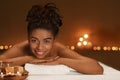 Portrait of cheerful african woman enjoying spa Royalty Free Stock Photo