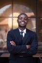 Portrait of cheerful african executive business man at the workspace office