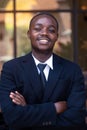 Portrait of cheerful african executive business man at the workspace office