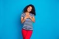 Portrait of cheerful afro american girl put hands palms on chest feel content thankful wear good looking outfit striped