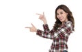 Portrait of cheerful asian woman pointing fingers at copyspace isolated over white background Royalty Free Stock Photo