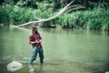 Portrait of cheerful bearded man fishing. Fisherman with fishing rod. Weekends made for fishing. Giving your hobby. With Royalty Free Stock Photo