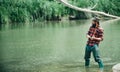 Portrait of cheerful bearded man fishing. Fisherman with fishing rod. Weekends made for fishing. Giving your hobby. With Royalty Free Stock Photo