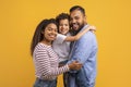 Portrait of cheerful black family with little son hugging and smiling Royalty Free Stock Photo