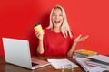 Portrait of cheerful blonde lady having fun at work place isolated Royalty Free Stock Photo