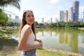 Portrait of cheerful Brazilian girl in Vaca Brava Park in Goiania, Goias, Brazil Royalty Free Stock Photo