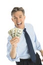 Portrait Of Cheerful Businessman Holding Dollar Bills Royalty Free Stock Photo