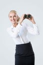 Portrait of a cheerful businesswoman holding binoculars - commercial concept Royalty Free Stock Photo