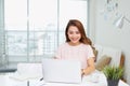 Portrait of a cheerful businesswoman sitting at the table in off Royalty Free Stock Photo