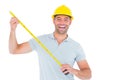 Portrait of cheerful carpenter holding tape measure Royalty Free Stock Photo