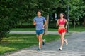 Portrait of cheerful caucasian couple running outdoors Royalty Free Stock Photo