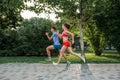 Portrait of cheerful caucasian couple running outdoors Royalty Free Stock Photo