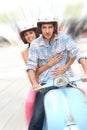 Portrait of cheerful couple riding the moto Royalty Free Stock Photo