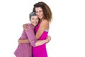 Portrait of cheerful daughter hugging mother