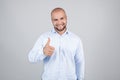 Portrait of cheerful delightful excited joyful handsome with beaming toothy shiny smile man wearing blue stylish modern shirt Royalty Free Stock Photo