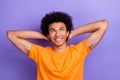 Portrait of cheerful dreamy guy youngster hands head take nap relaxation look interested drowse pause isolated on purple