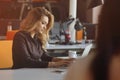 Portrait of cheerful employer of business enterprise enjoying creative working process in modern office indoors Royalty Free Stock Photo