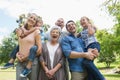 Portrait of cheerful extended family at park