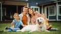 Portrait of a Cheerful Family Couple with a Son and Daughter, and a Beautiful Golden Retriever Dog Royalty Free Stock Photo