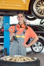 Portrait of a cheerful female auto mechanic wearing safety equipment Royalty Free Stock Photo